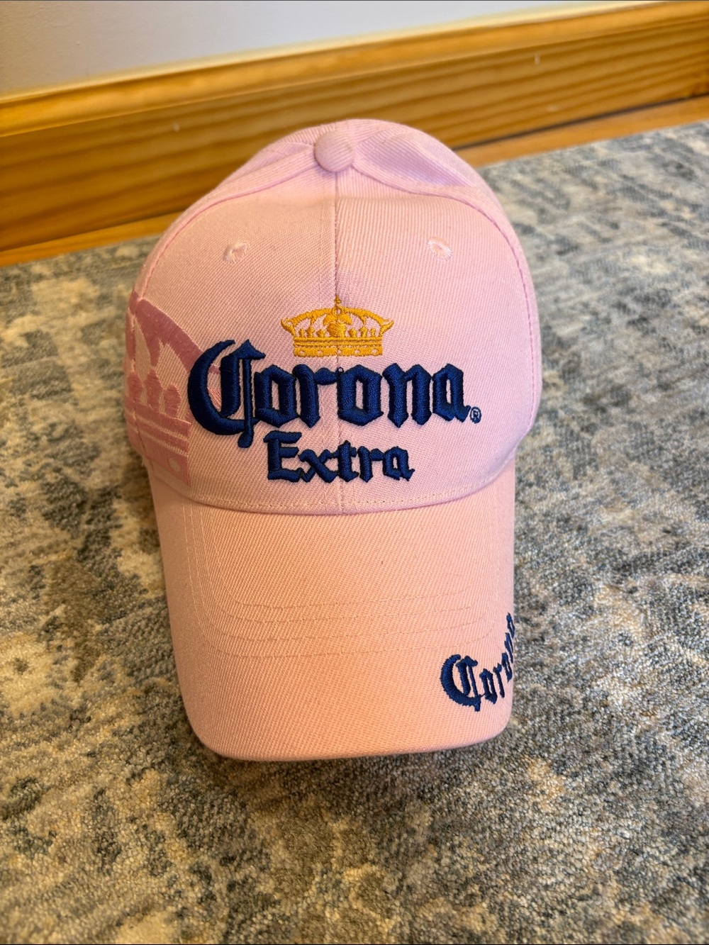 Corona Pink Hat with Navy Label and Gold Crown Stitching